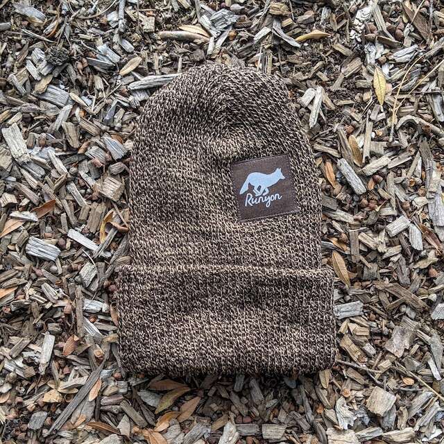 Runyon Wild Cocoa Reflective Performance Knit Beanie
a brown heather marl beanie compliments our dark brown reflective patch