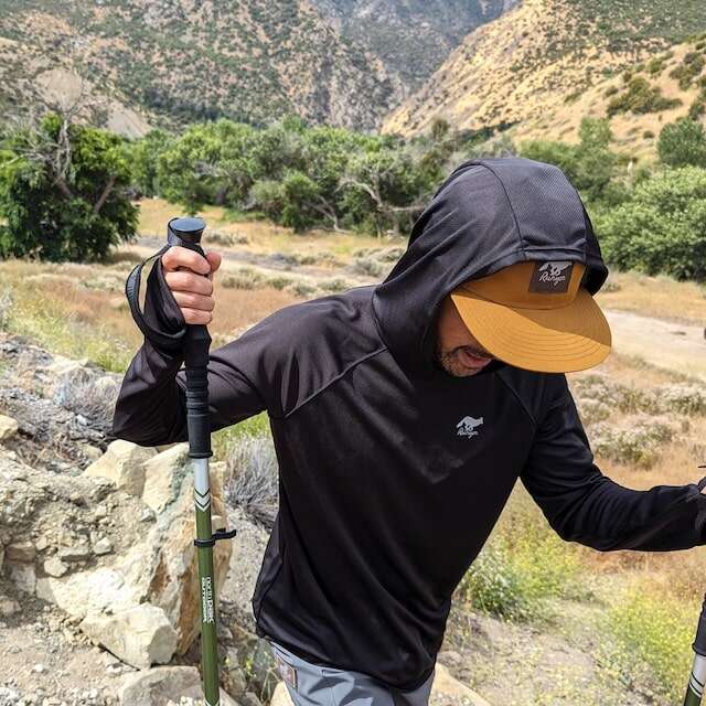 Black color long sleeve technical hoodie shirts with built-in thumbholes UPF protection for running, hiking, fitness, gym, workouts.  American Made In USA. Runyon Canyon Apparel